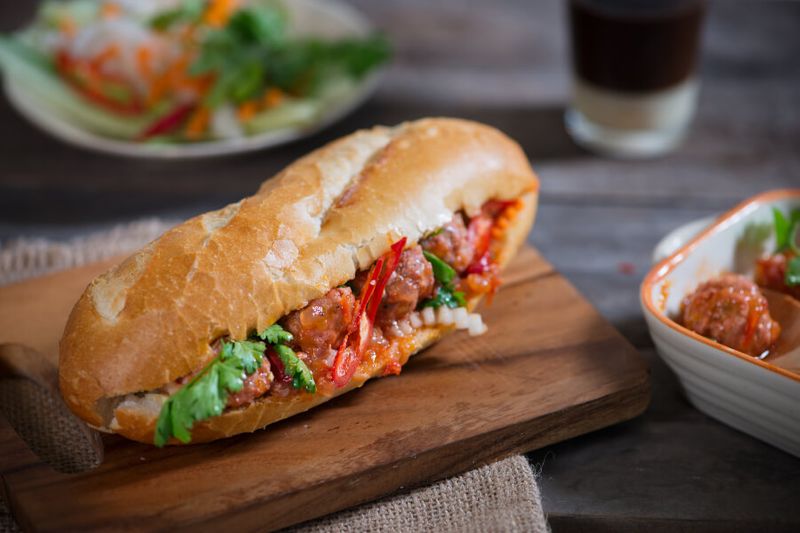 The Vietnamese sandwich called Banh Mi which is made out of a french baguette like bread, meat, coriander leaves, and carrot pickle