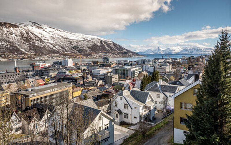 View of the Arctic town of Tromso with quaint old wooden houses.