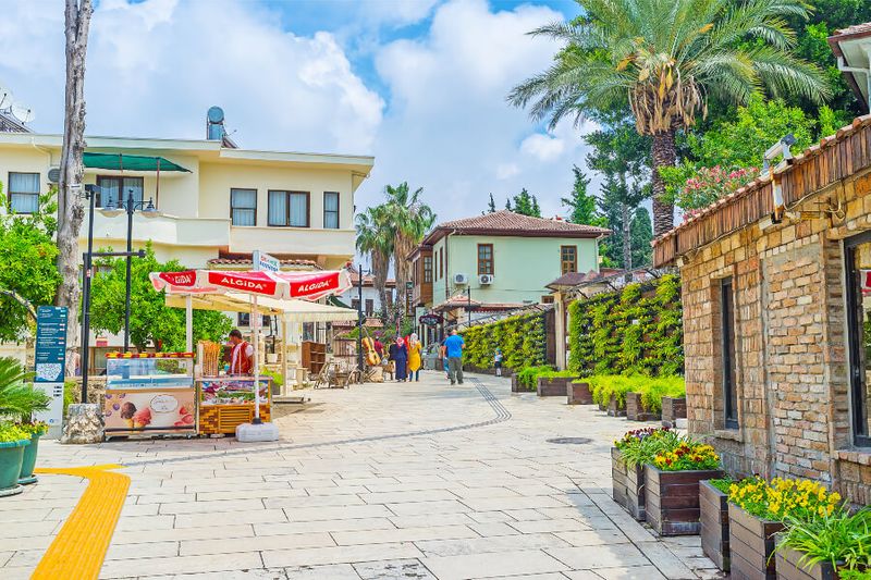 The scenic streets of the Kaleici District with a walled garden, an  ice cream stall and Ottoman houses.