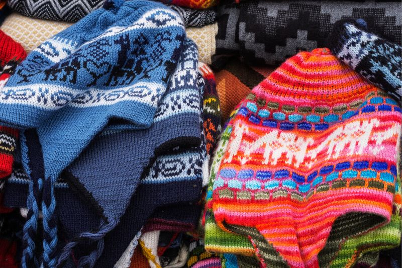Traditional Peruvian Chullo hats in a market.