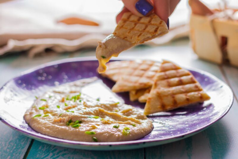 Taramasalata contains salted and cured fish roe, and is served with either bread or potatoes.