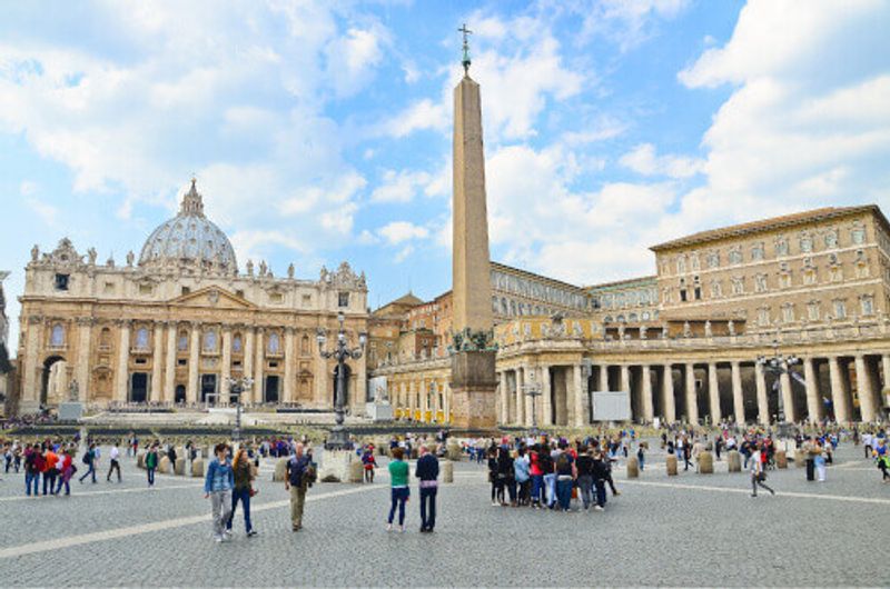 Tourists at Saint Peters Square in Vatican City.