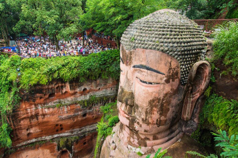The 71m tall Giant Buddha carved out of the mountain in the 8th century in Leshan.