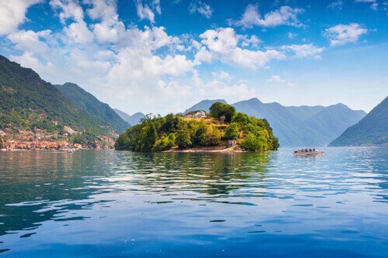 Colourful summer view of the Island of Comacina on Lake Como.