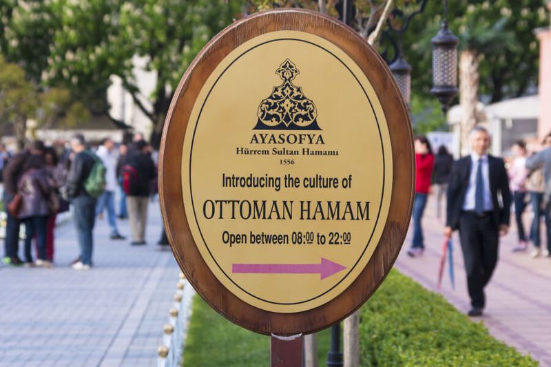 The Ayasofia Turkish Bath House sign next to the Hagia Sophia Mosque.