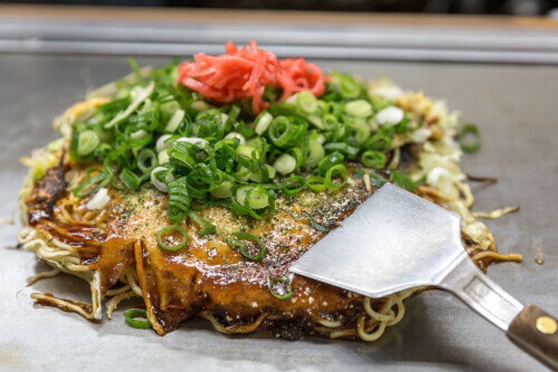 Okonomiyaki Japanese Pizza, done in the style of Hiroshima, in Japan.