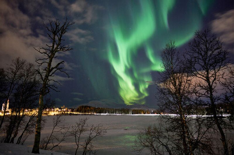 The northern lights display above Prestvannet in Tromso, Norway.