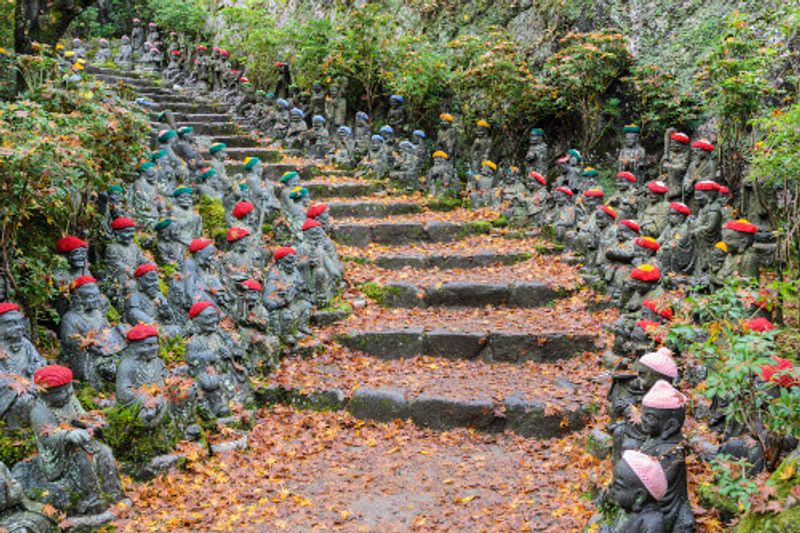 Buddha lined pathways at Daisho-in Temple grounds in Miyajima Island, Hiroshima, Japan