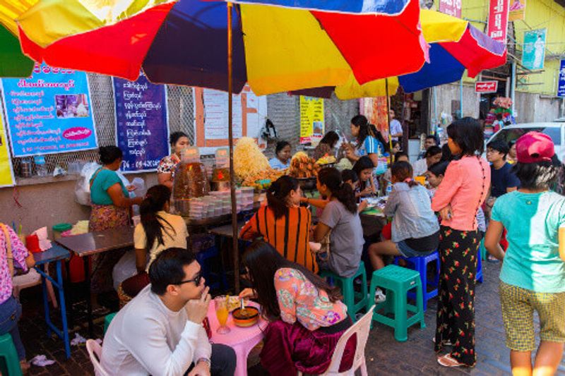 Bogyoke Aung San Market, formerly Scotts Market, with locals eating in the Pabedan township.