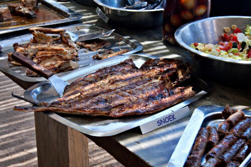 Freshly grilled snoek fish,  a traditional South African dish, served at restaurant.