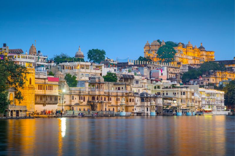 The City Palace and Lake Pichola at night.