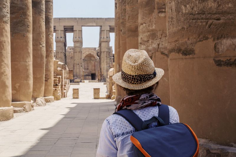 A tourist at the ancient Temple of Karnak