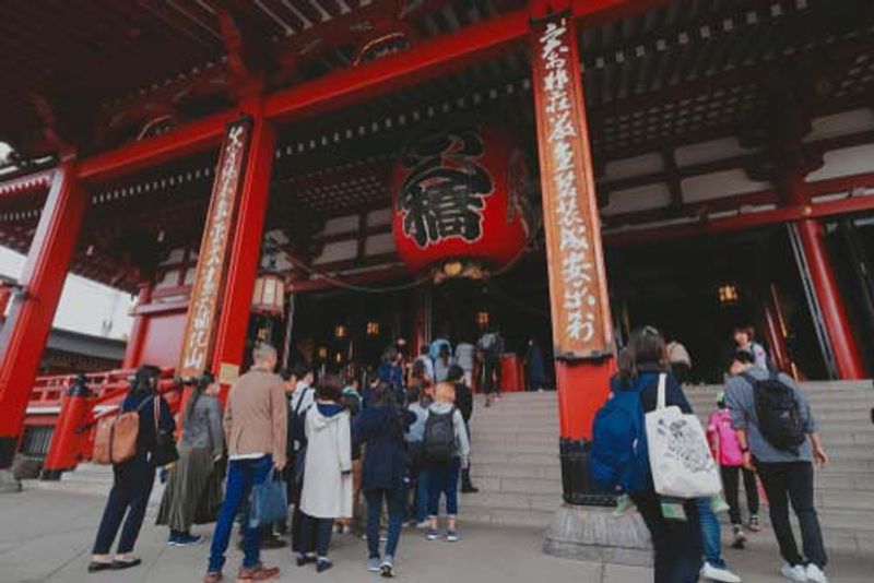 Visitors wait to enter the Sensoji Temple, Tokyo.