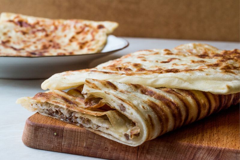 Turkish pastry called Gozleme made from dough, minced meat, vegetables and cheese
