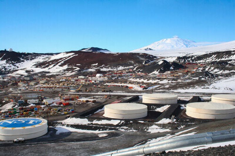 View of a research station with Mount Erebus in view, Mcmurdo Station, Antarctica.