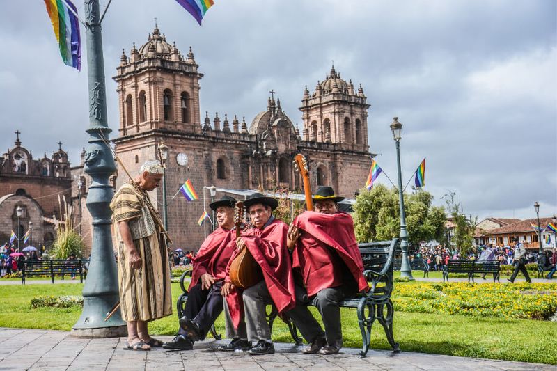 Group of performers for the Inti Raymi Festival sitting in Plaza de Armas.