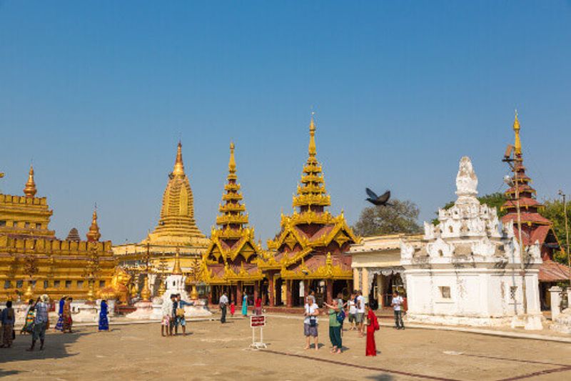 Tourists and locals tour the ancient temples of Bangan.