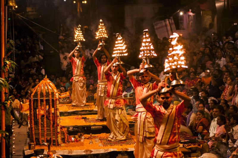 Alongside the Ganges, priests hold traditional Hindu aarti's.