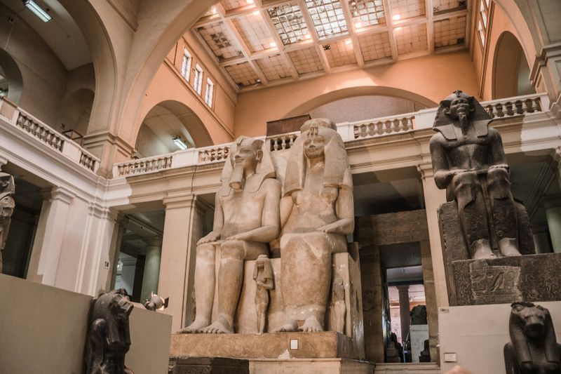 The limestone statue of King Amenonphis III and Queen Tyi on display at the Museum of Egyptian Antiquities.