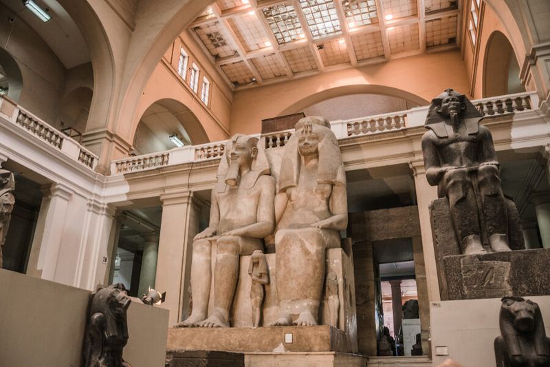 The limestone statue of King Amenonphis III and Queen Tyi on display at the Museum of Egyptian Antiquities.