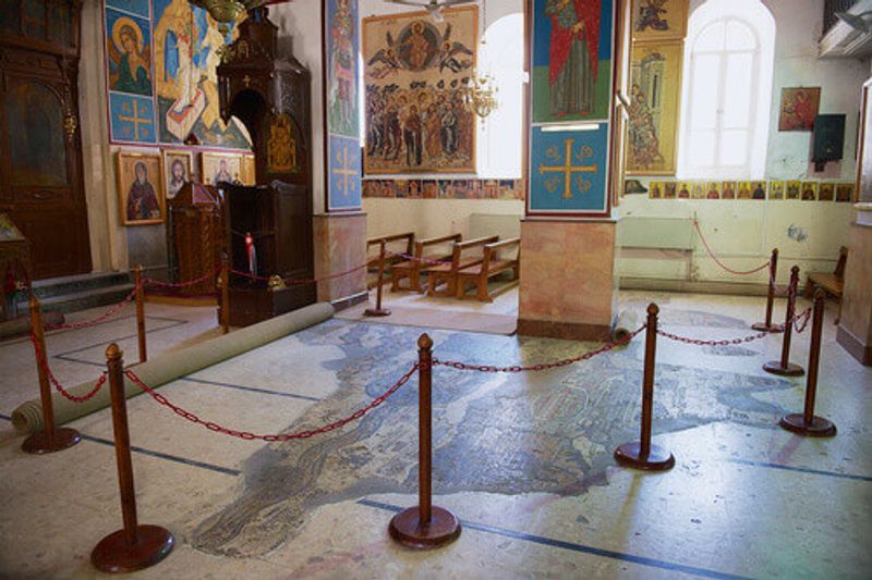Interior of the Greek Orthodox Basilica of St George with the mosaic map of the Holy Land in Madaba, Jordan.