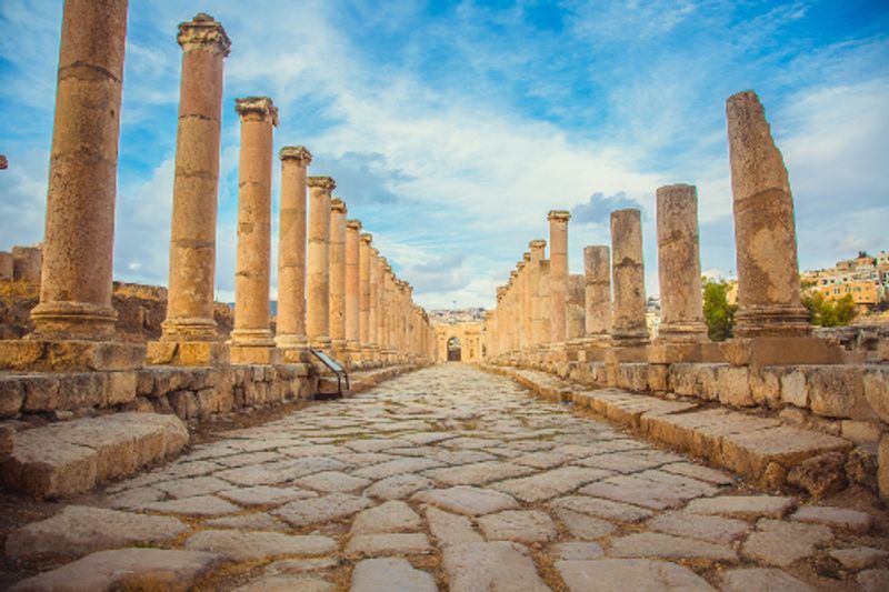 The ruins of an Ancient Roman walkway, with great columns in Jerash, Jordan.