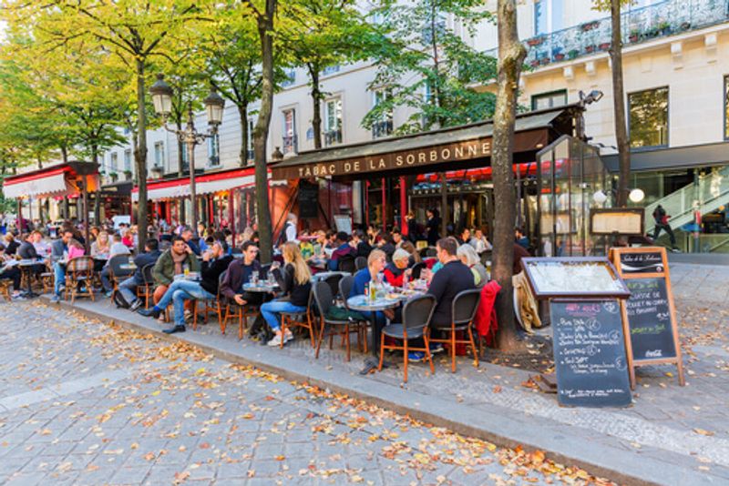 A typical, bustling French Cafe, frequented by locals and tourists alike.