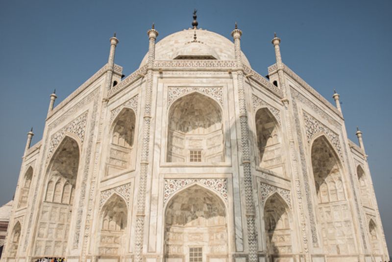 Tourists flock to the Taj Mahal each year to see the stunning marble facades.