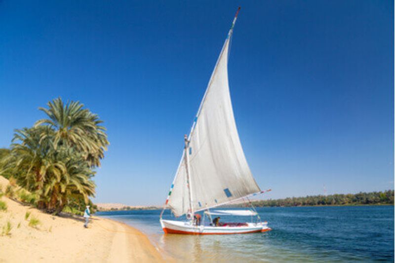 A Felucca traditional wooden sailboat on the shore of the Nile River, Egypt.