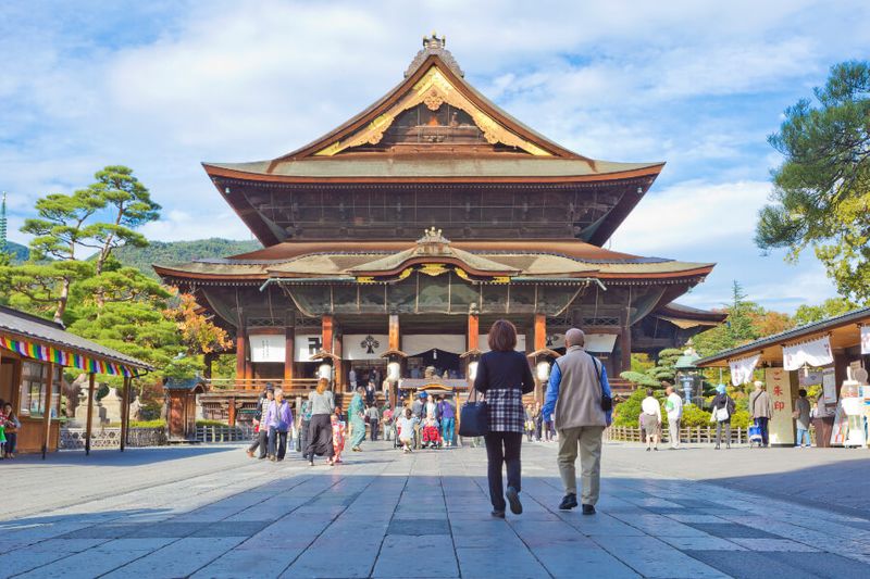 The Zenkoji Temple with locals and tourists exploring.