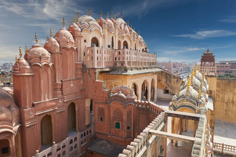 Hawa Mahal sits in the streets of Jaipur, it's pink facade inviting visitors in.