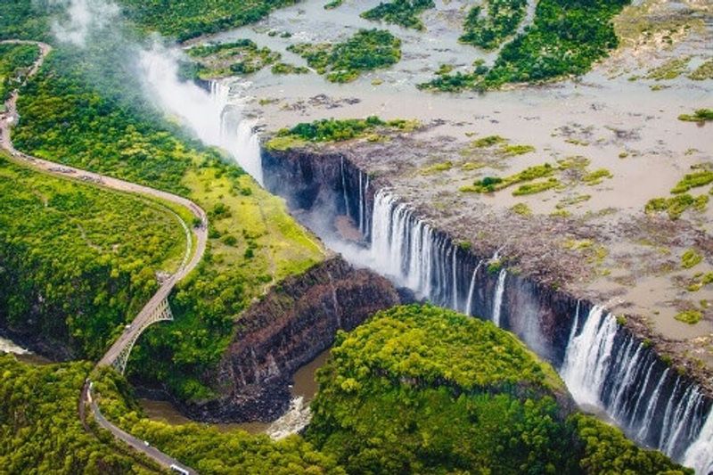 Victoria Falls or Mosi-oa-Tunya which translates to The Smoke that Thunders.