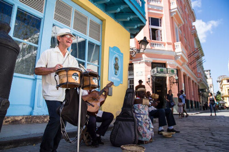 Musicians playing traditional Cuban music beside the Ambos Mundos Hotel where Ernest Hemingway once stayed.