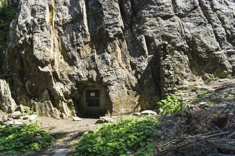 Rock climbing route on a cliff with a bunker in Switzerland.