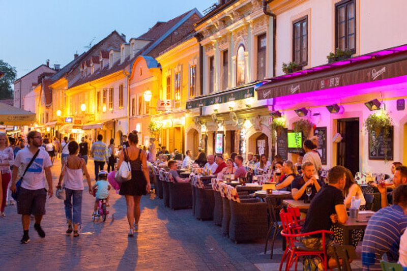 Locals and tourists eating at restaurants in Ivana Racica Street.