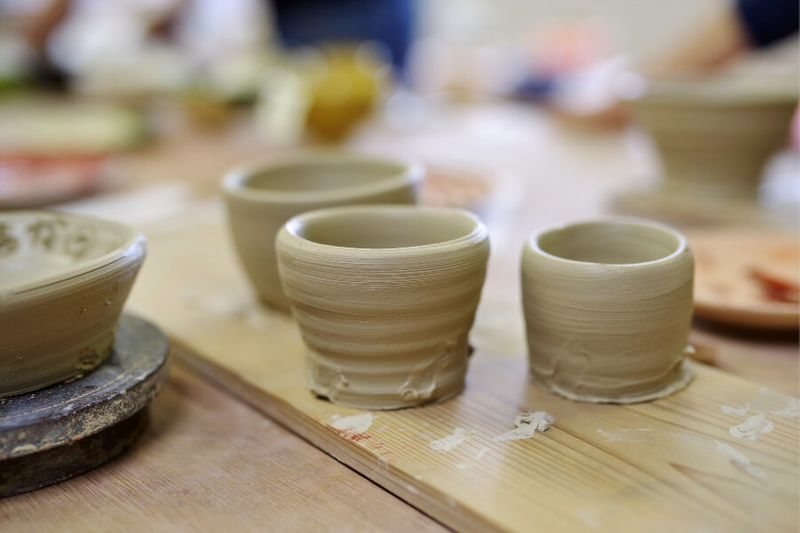 Person making a ceramic pot in a Japanese pottery class