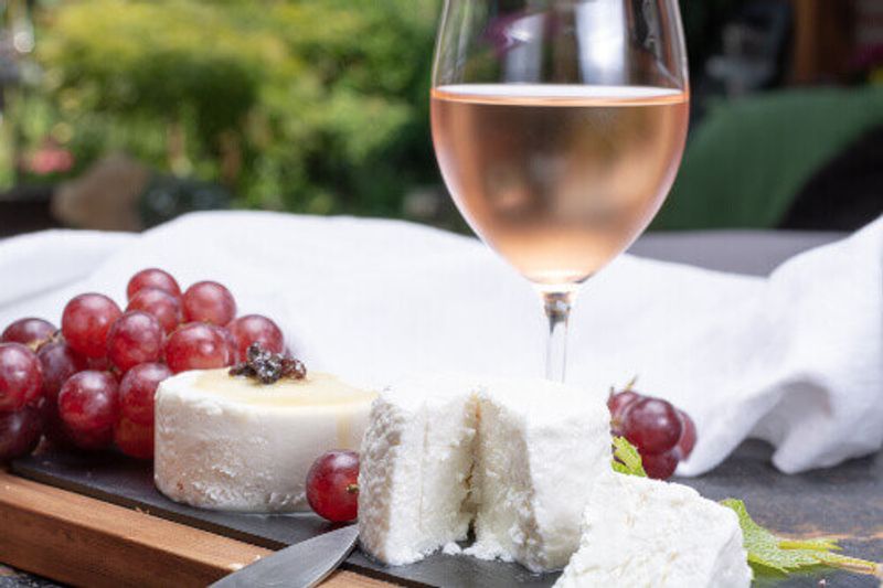 French soft cheeses, with variety of different tastes, served as a dessert with cold wine from Provence