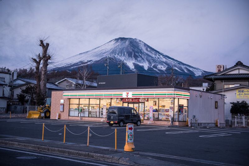 A 7-Eleven store in front of Mt. Fuji.