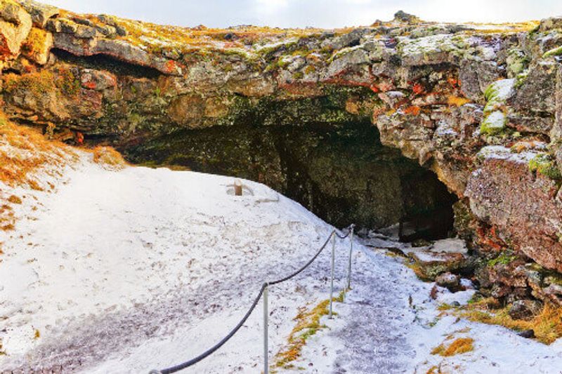Entrance to the Vatnshellir Lava Cave during winter on the Snaefellsnes Peninsula.
