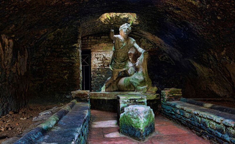 Statue of the god Mithras killing a bull in the mithraeum of Ostia Antica in Rome.
