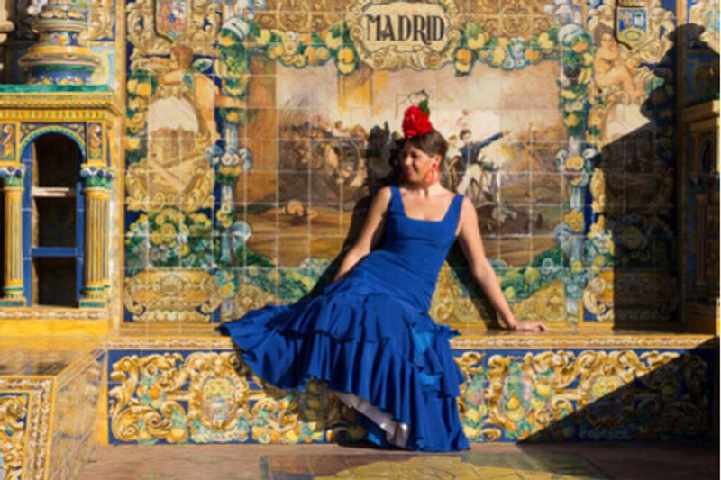 A Flamenco dancer lounges on the street in Madrid, Spain.