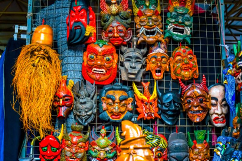 Traditional masks are still sold at Beijing markets.