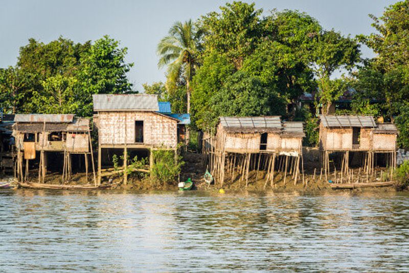 Huts on the riverbank at a fishing village.