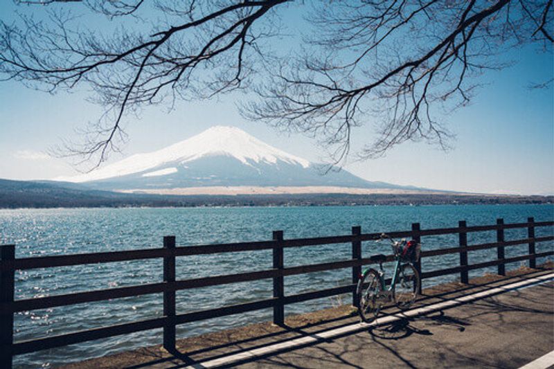 A landscape of Lake yamanake with Mount Fuji in the background.