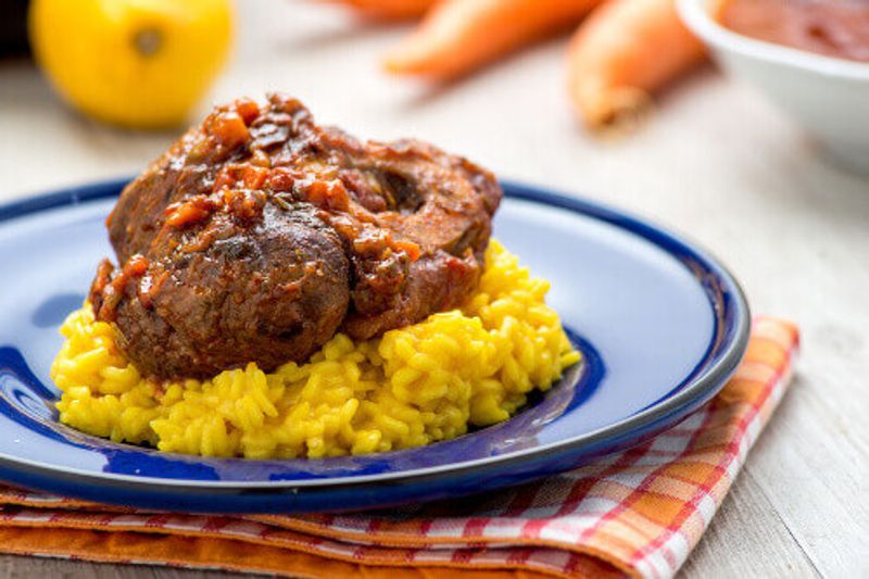 Osso buco alla milanese with risotto on a plate