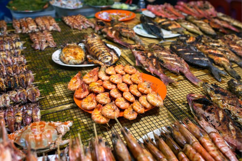 A variety of grilled seafood at a food market in Kota Kinabalu