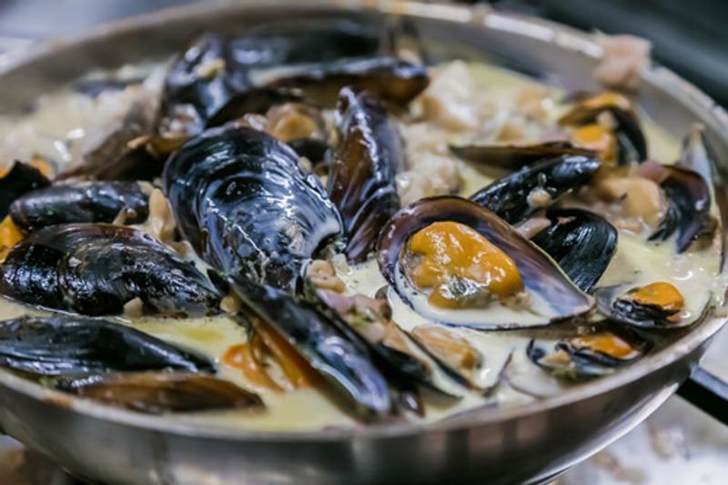 Muscles in creamy sauce are a local South African dish.