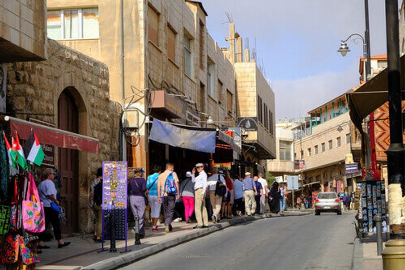 Souvenirs on a busy street in Madaba, Jordan.