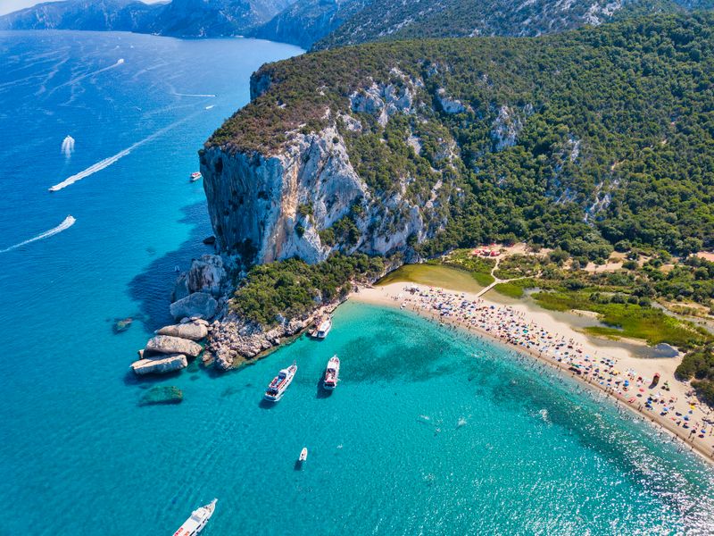Pristine waters and dramatic cliffs at Cala Luna Beach, one of Sardinia’s most stunning coastal gems