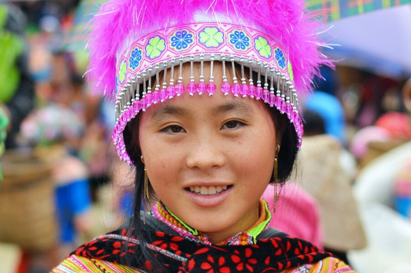 Young Vietnamese Flower Hmong Hill tribe woman wearing colourful traditional flower costume.